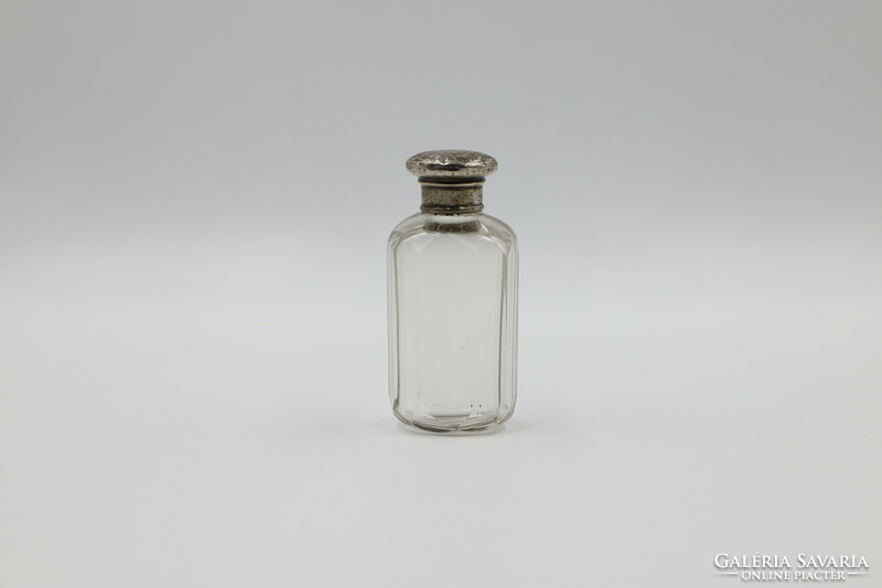 Perfume bottle with silver cap