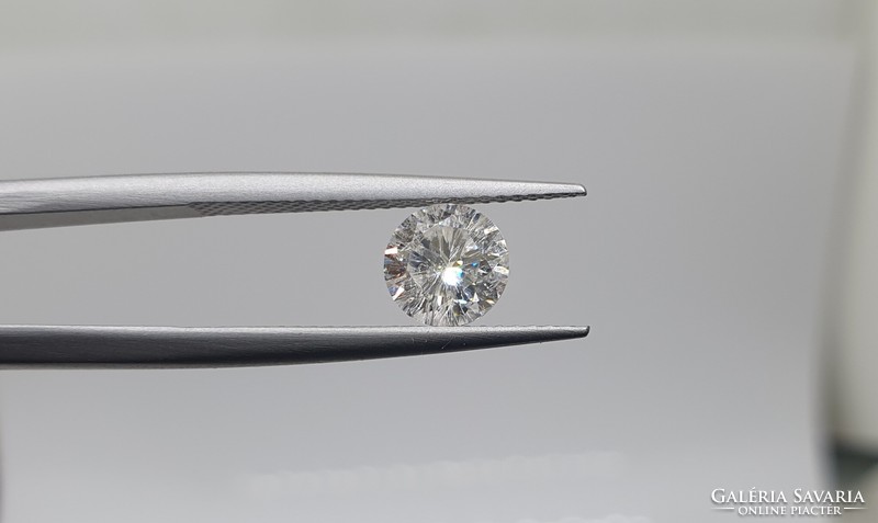 0.95 carat brill cut moissanite. With certification.