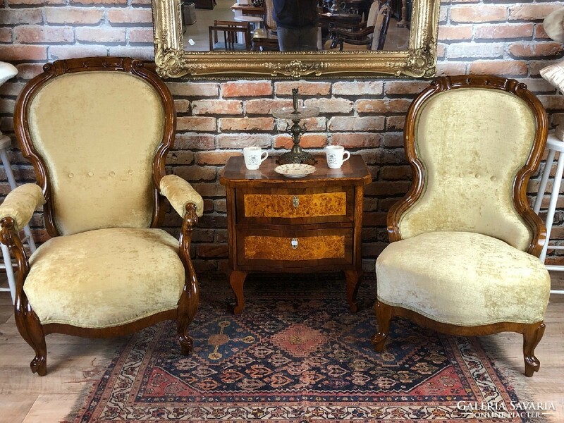 A pair of neo-baroque restored armchairs.