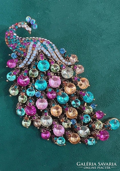 Giant peacock brooch, in several colors.