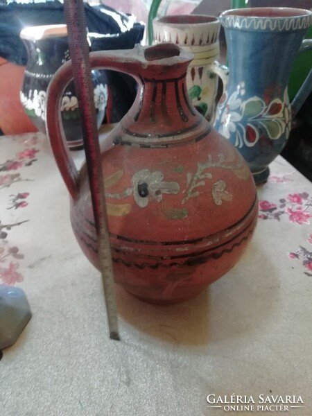 Antique folk jug 1 is in the condition shown in the pictures