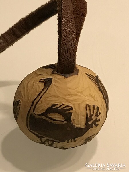 African hand-carved pendant on a leather strap, diameter 3.5 cm, leather 80 cm long