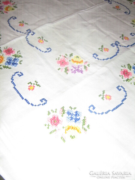 Hand-embroidered filigree tablecloth with beautiful floral cross stitches