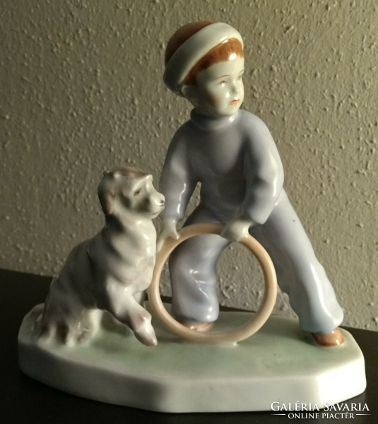 Zsolnay figurine of a boy with a dog and hoop