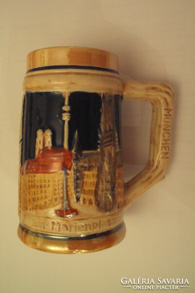 German ceramic beer mug with a plastic surface, with the inscription Munich on the rim.