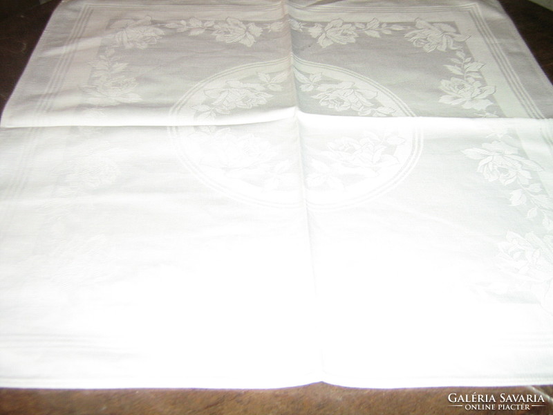 Snow white damask napkin with a beautiful rose pattern