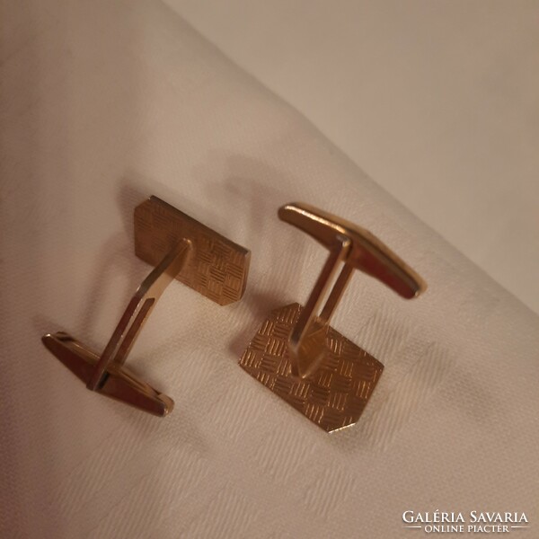 A pair of gold-colored, mother-of-pearl inlaid, domino pattern cufflinks