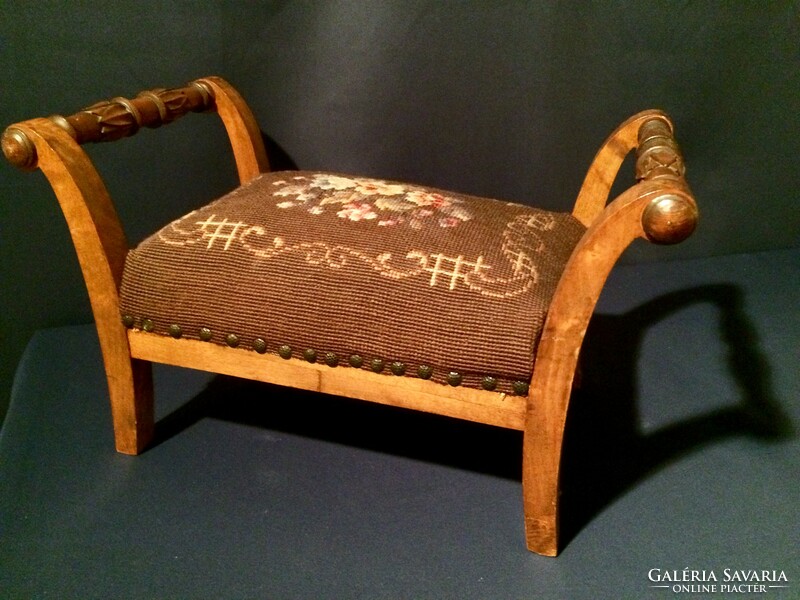 Beautiful small footstool covered with tapestry