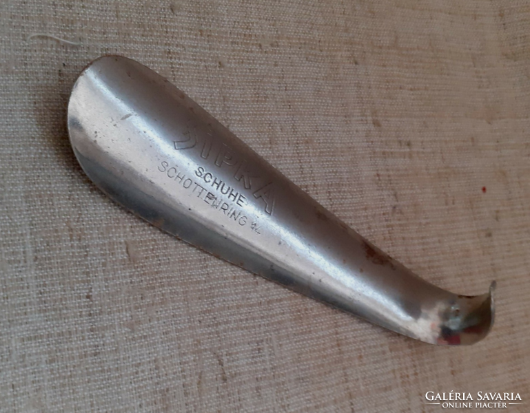 Old marked metal shoe spoon in usable condition