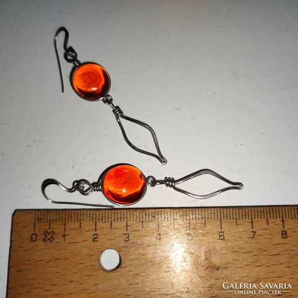 Special long metal orange glass eye earrings