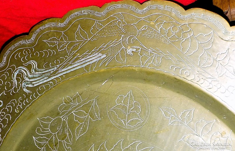 A huge Chinese bronze or copper bowl with a dragon
