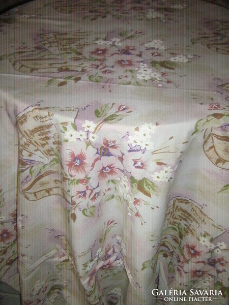 A beautiful vintage-style bed linen set with a floral violin sheet music pattern