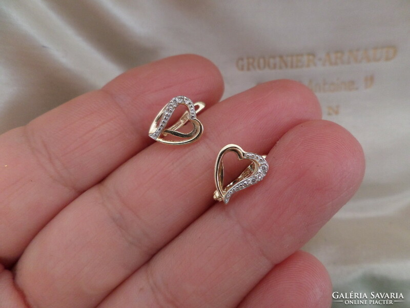 Gold heart earrings with a couple of small diamonds