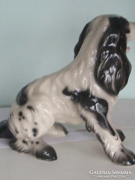 Large spaniel dog statue.