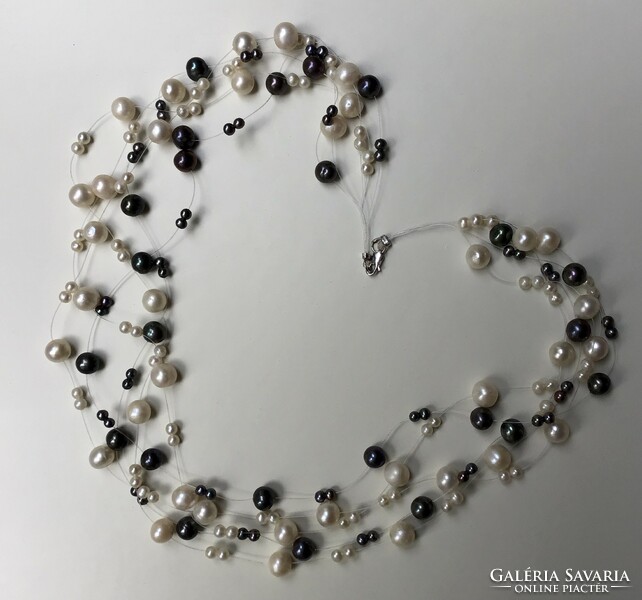 Multi-row necklace made of real pearls with a 14-karat white gold clasp