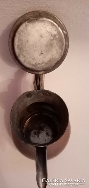 Antique metal spout with tilting lid
