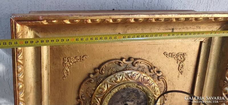 Antique Biedermeier frame clock in an ox-eye laminated frame. Wall clock.