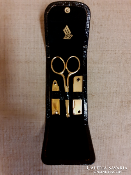 Old gold-plated travel manicure set in a black case
