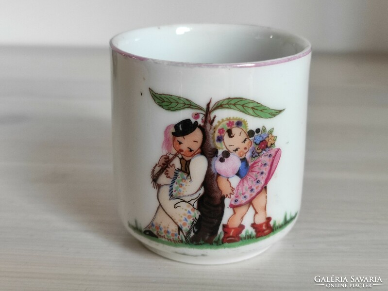 A rare hand-painted small mug from Zsolnay with a charming scene
