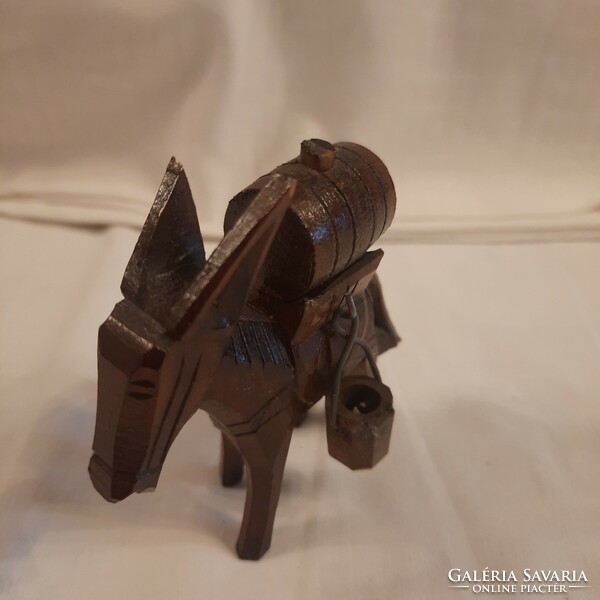 Carved donkey carrying water