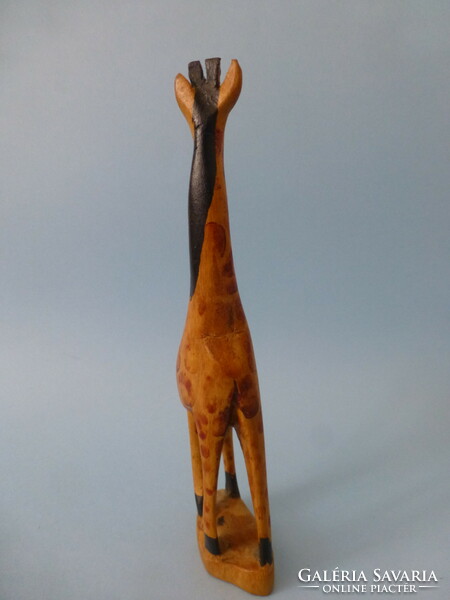 Carved wooden giraffe statue