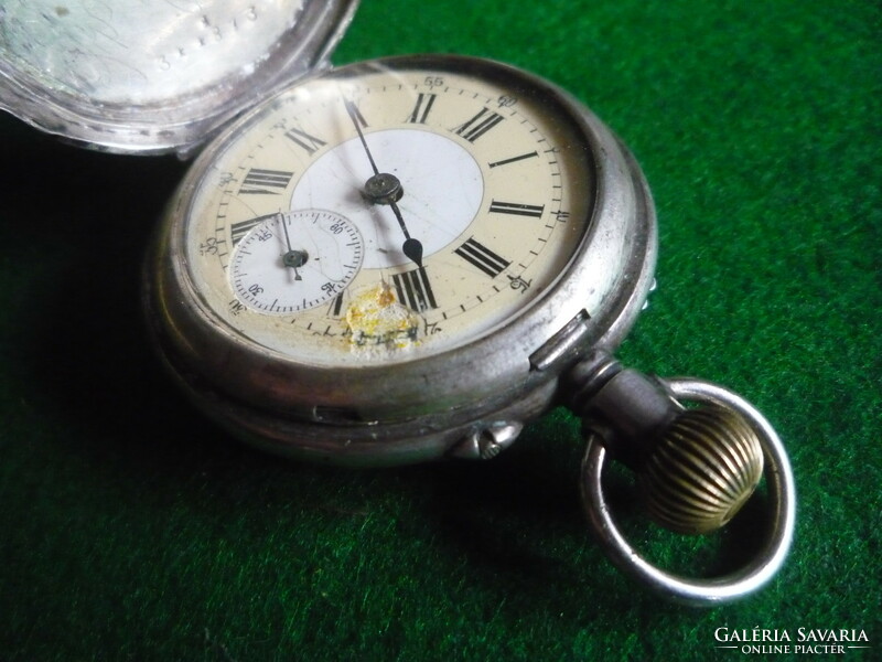 Silver pocket watch. Axial.