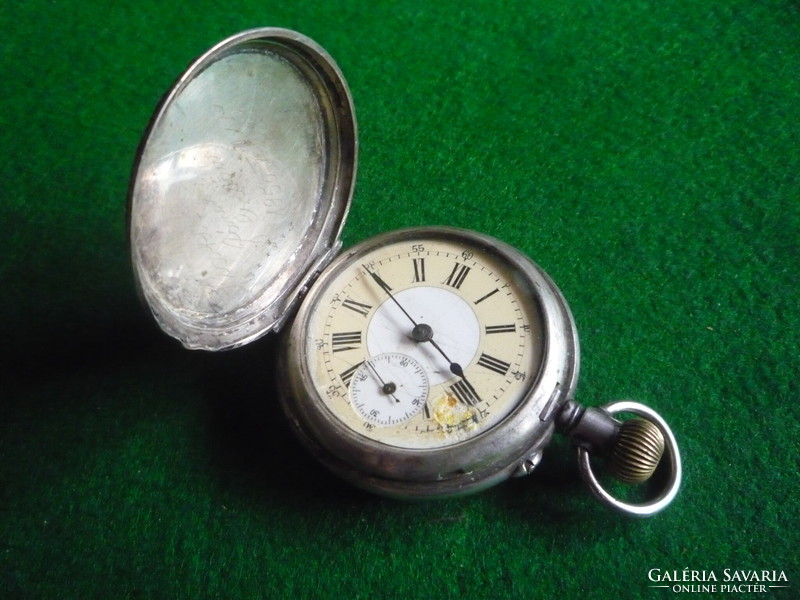Silver pocket watch. Axial.