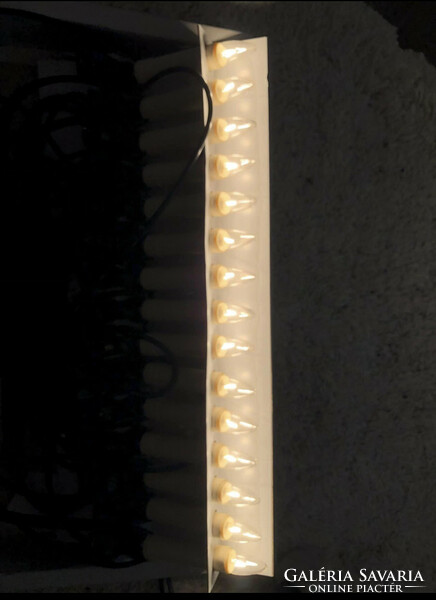 A candle-shaped string of light bulbs
