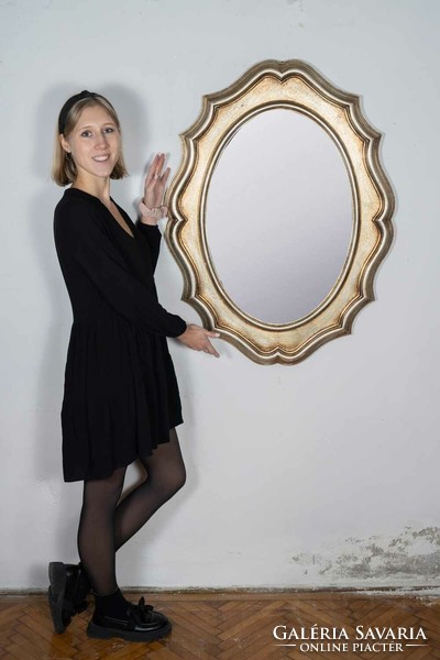 Oval mirror with gilded wooden frame