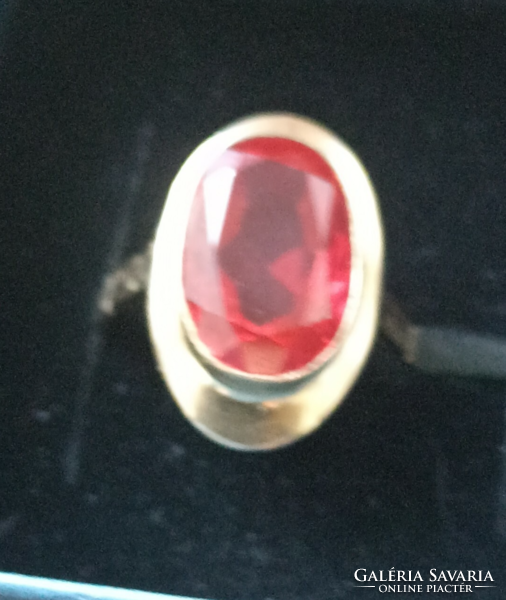 Large gold ring with a ruby-colored stone, very beautiful, serious women's