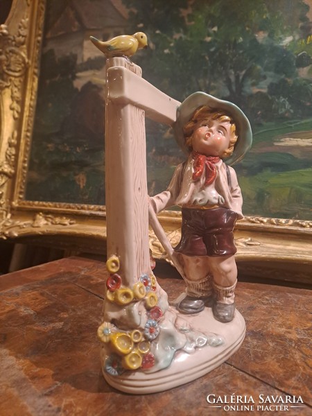 The little boy scout with a bird: German porcelain figure