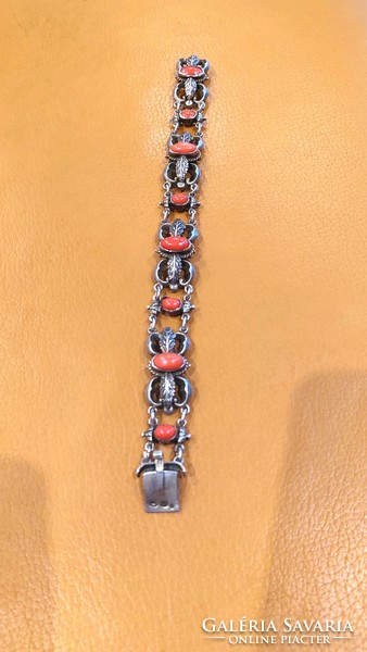Old silver bracelet with coral decoration