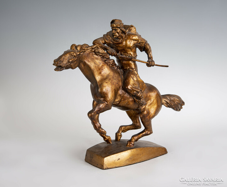 Gilded plaster warrior statue on horseback