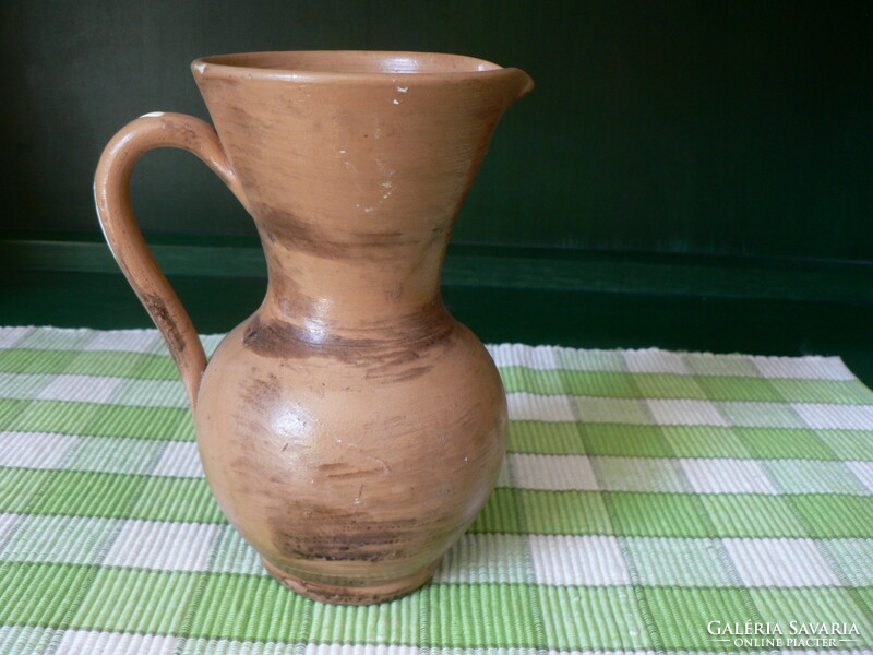 Old earthenware jug with handle