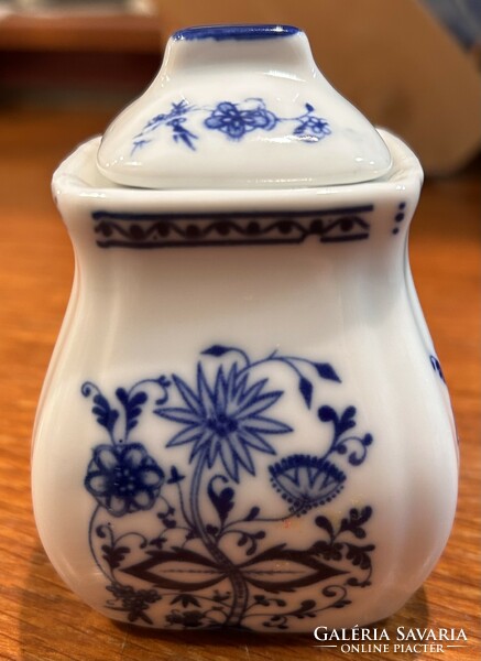 A small spice holder with an onion pattern