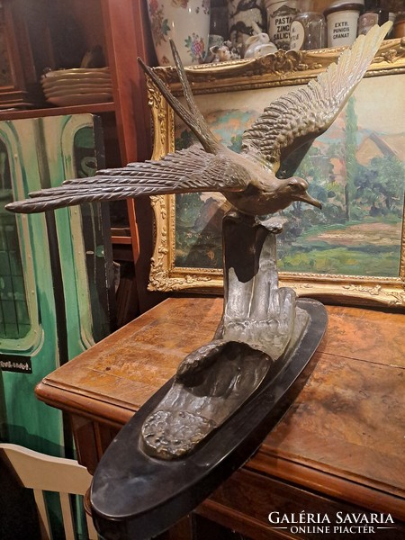 Old huge marked bronze seagull statue