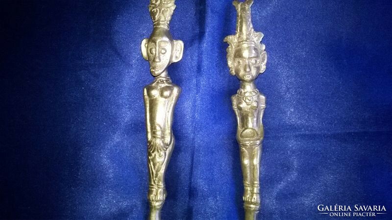 A rare pair of decorative copper spoons