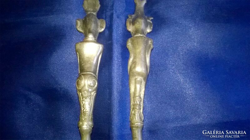 A rare pair of decorative copper spoons