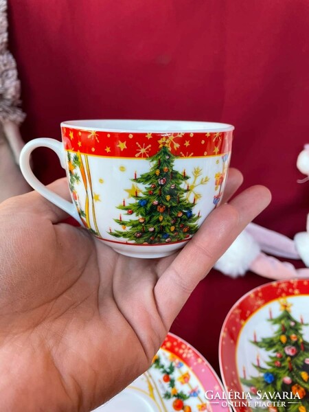 A beautiful trio of porcelain tea sets with a Christmas pattern