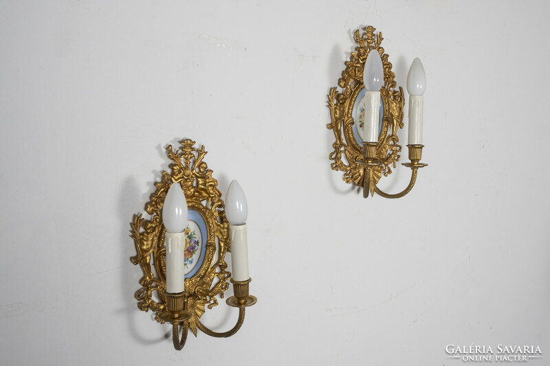 Neo-baroque gilded wall arm paired with porcelain insert