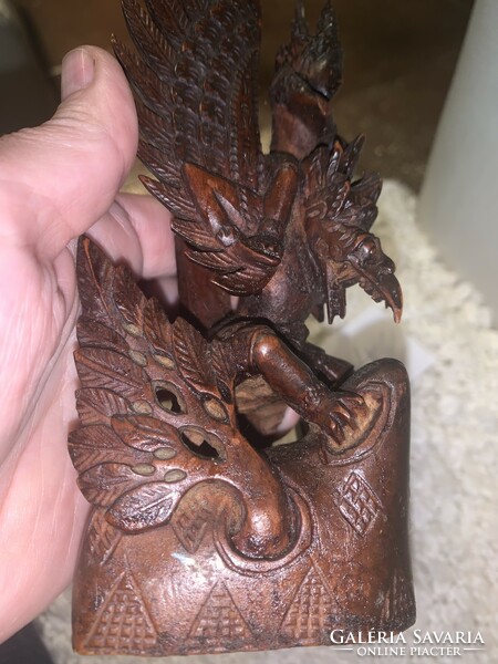 Indonesian hand carved detailed statue of vishnu riding on the back of a garuda