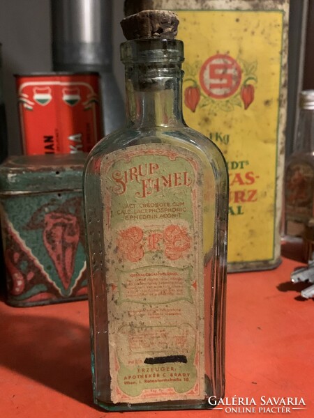 Old medicine bottle from the time of the monarchy with sirup famel