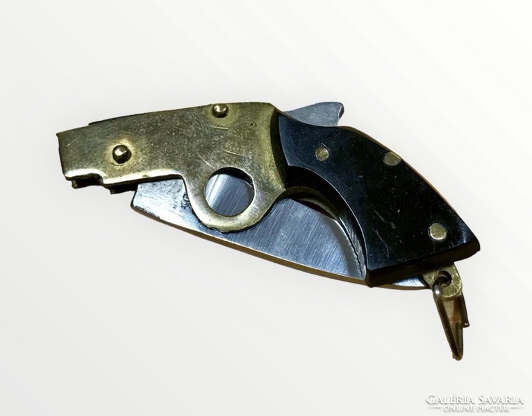 Knife in the shape of a pistol