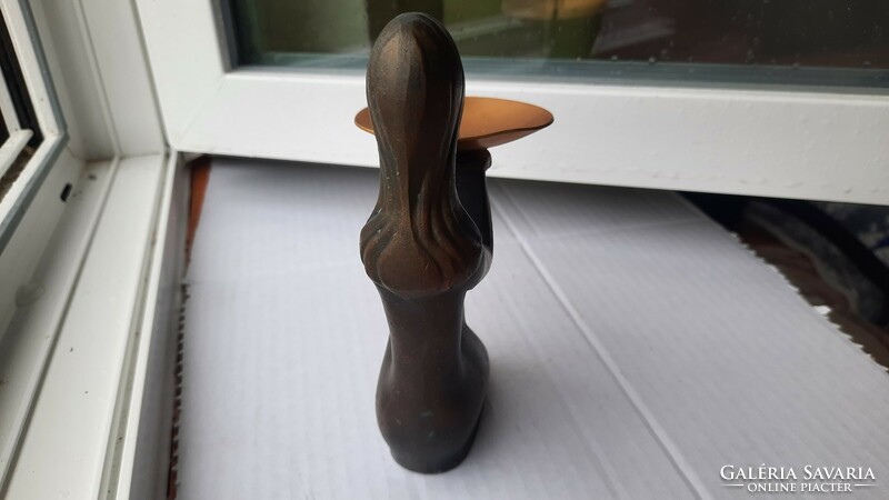 Stylish retro candle holder in a female shape