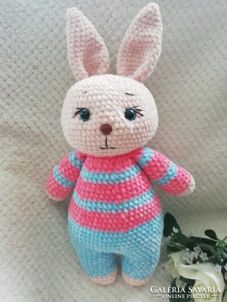 Crocheted plush bunny in pajamas