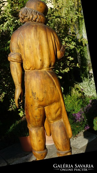 18th century wooden statue-boots company.