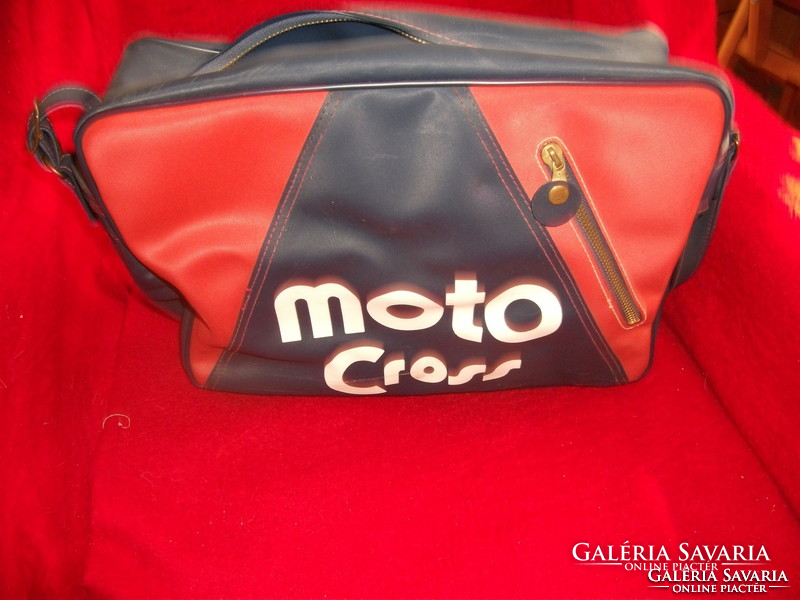 With retro motocross inscription. Red and dark blue sport bag that can be hung on the shoulder, unused