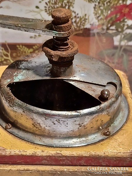 Very old coffee grinder with aero inscription