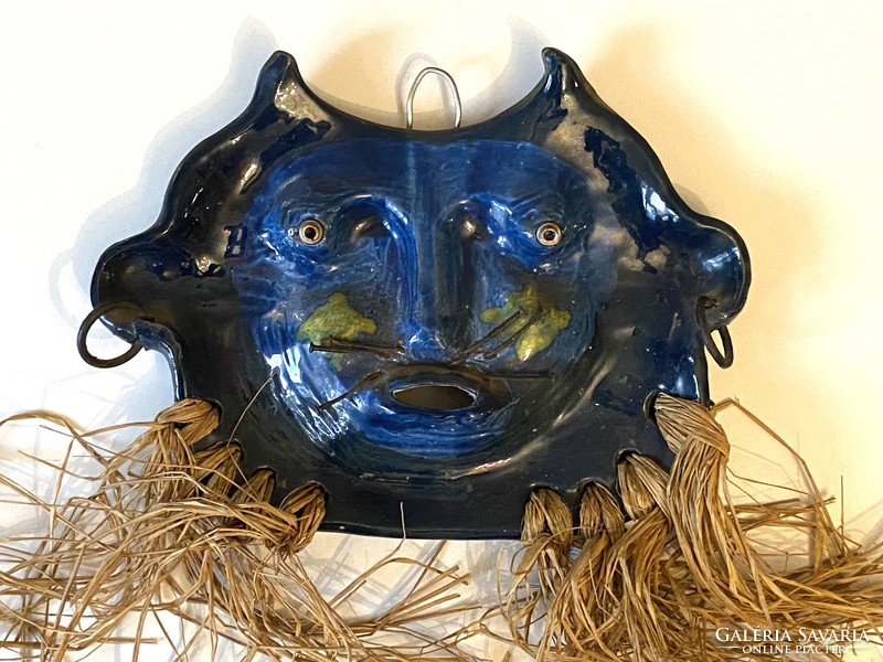 Painted ceramic wall mask with a mustache made of iron nails and a bushy beard