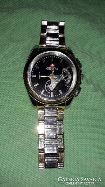 Geneva Swiss working quartz watch in good condition with metal strap as shown in the pictures